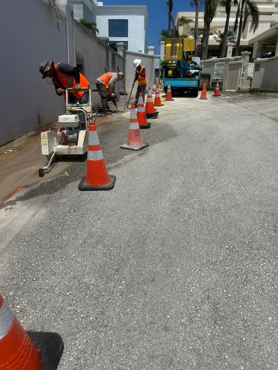 CTS Pacific crew performing narrow trenching along a paved infrastructure pathway.